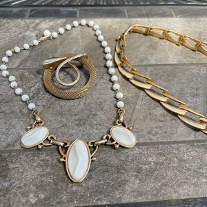 Vintage Monet plus other choker necklaces and a gold tone broach